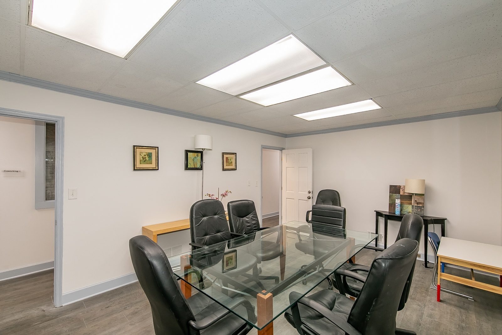 Conference room viewed from the opposite end of the glass table