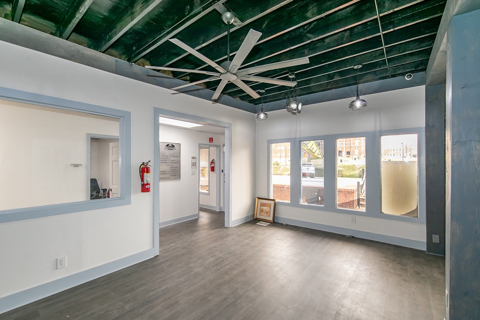 Original painted brick wall in Suite 100